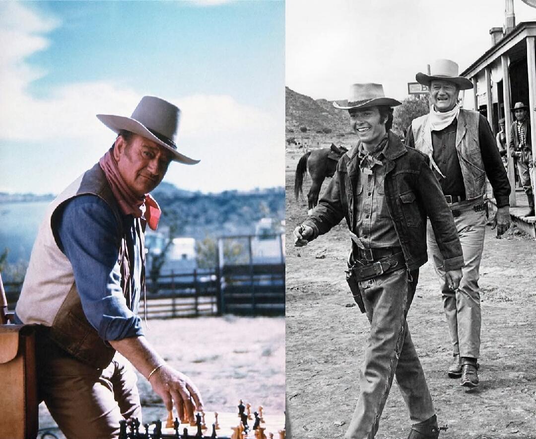 A split image featuring John Wayne. On the left, a color photo shows him in a cowboy hat and vest, playing chess outdoors with a lake in the background. On the right, a black and white photo shows him walking alongside another man, both dressed as cowboys, in a Western town setting.