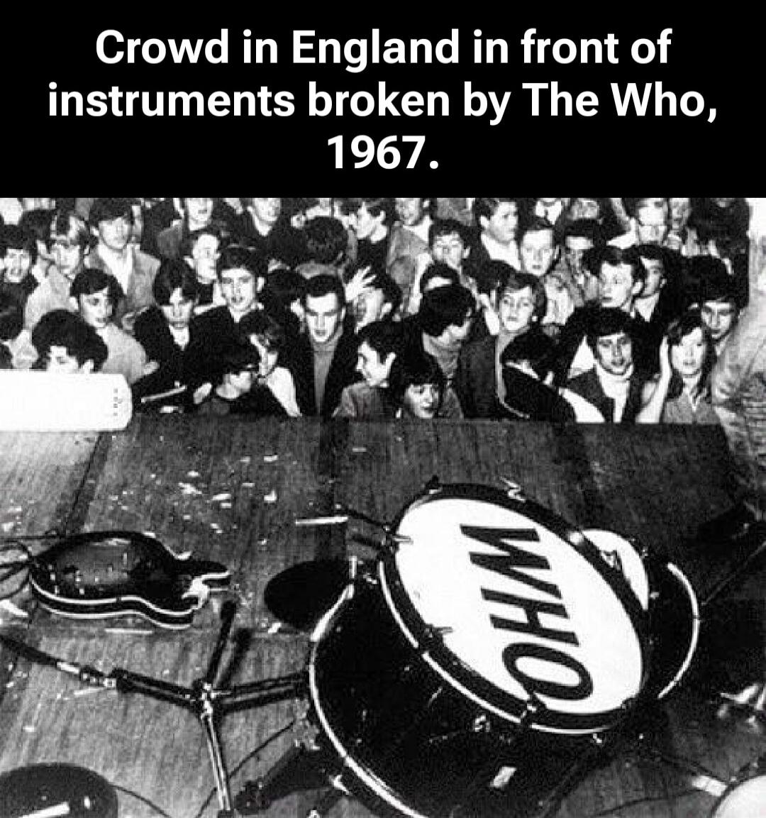 Crowd in England in front of instruments broken by The Who, 1967.