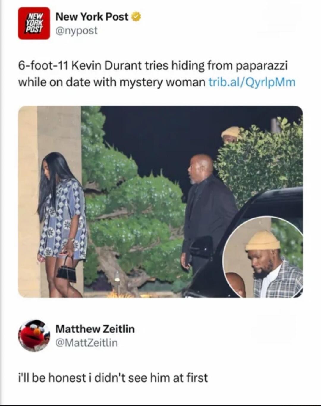 New York Post reports that 6-foot-11 Kevin Durant tries hiding from paparazzi while on a date with a mystery woman. The image shows him attempting to conceal himself behind a small bush, with only the top of his head visible. Another person, Matthew Zeitlin, comments, 'I'll be honest I didn't see him at first,' highlighting the humorous futility of