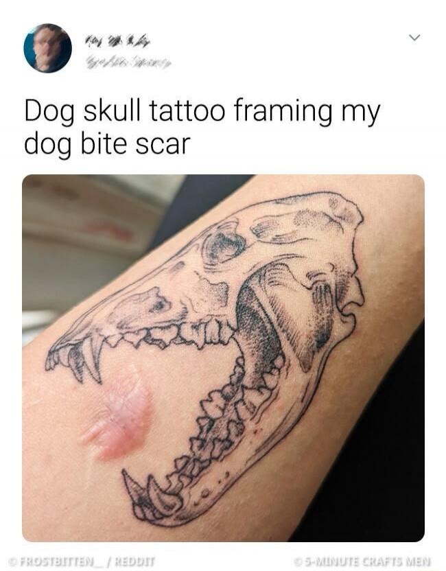 Dog skull tattoo framing my dog bite scar