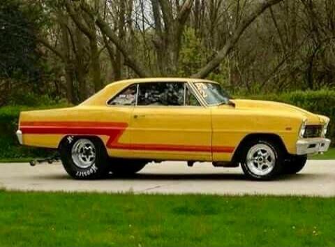 Yellow vintage car with red stripe