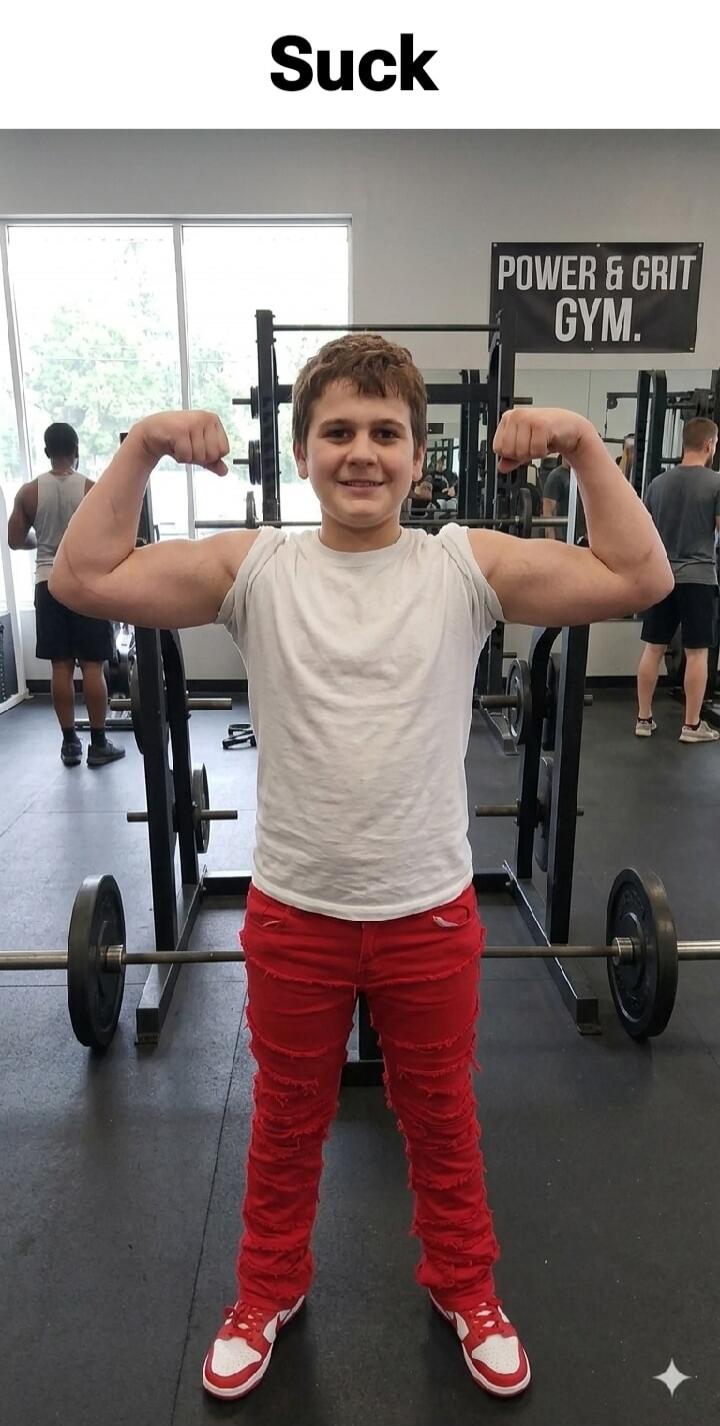 Suck. POWER & GRIT GYM. A young boy is flexing his muscles in a gym.