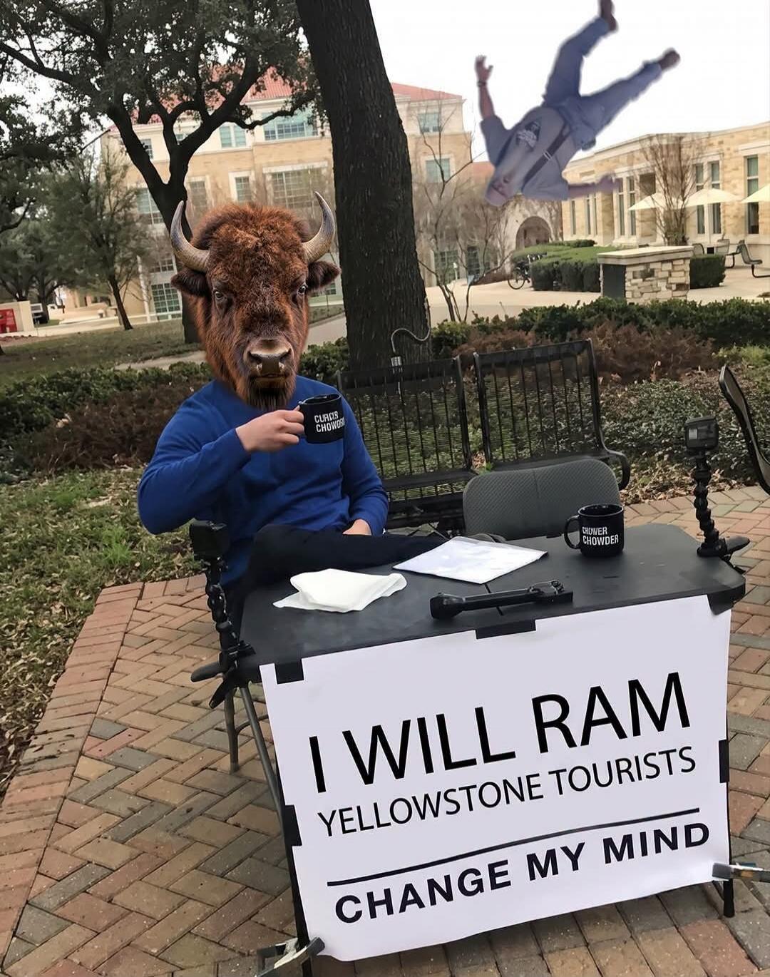 I WILL RAM YELLOWSTONE TOURISTS CHANGE MY MIND CROWDER CHOWDER A person with a bison head mask is sitting at a table with a sign that reads 'I will ram Yellowstone tourists, change my mind'. Another person is falling in the background. The person is holding a mug that says 'Crowder Chowder'.