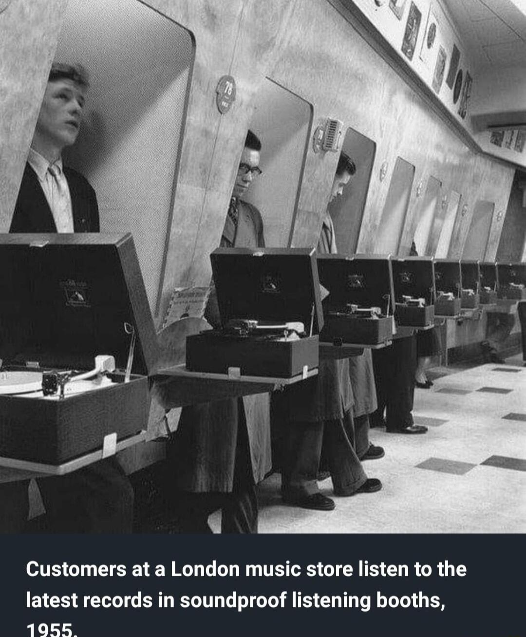 Customers at a London music store listen to the latest records in soundproof listening booths 19585