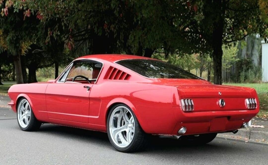 Red classic Ford Mustang (1960s).
