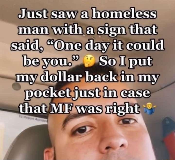 F 3 Justisawalthomeless man with a sign that