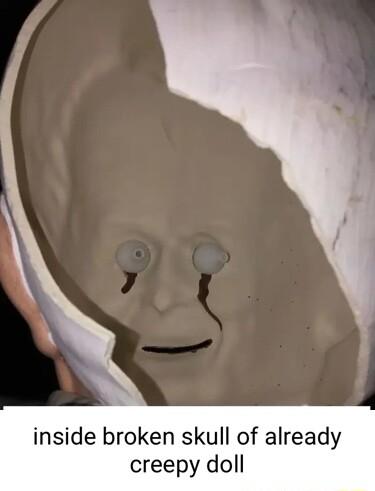 inside broken skull of already creepy doll