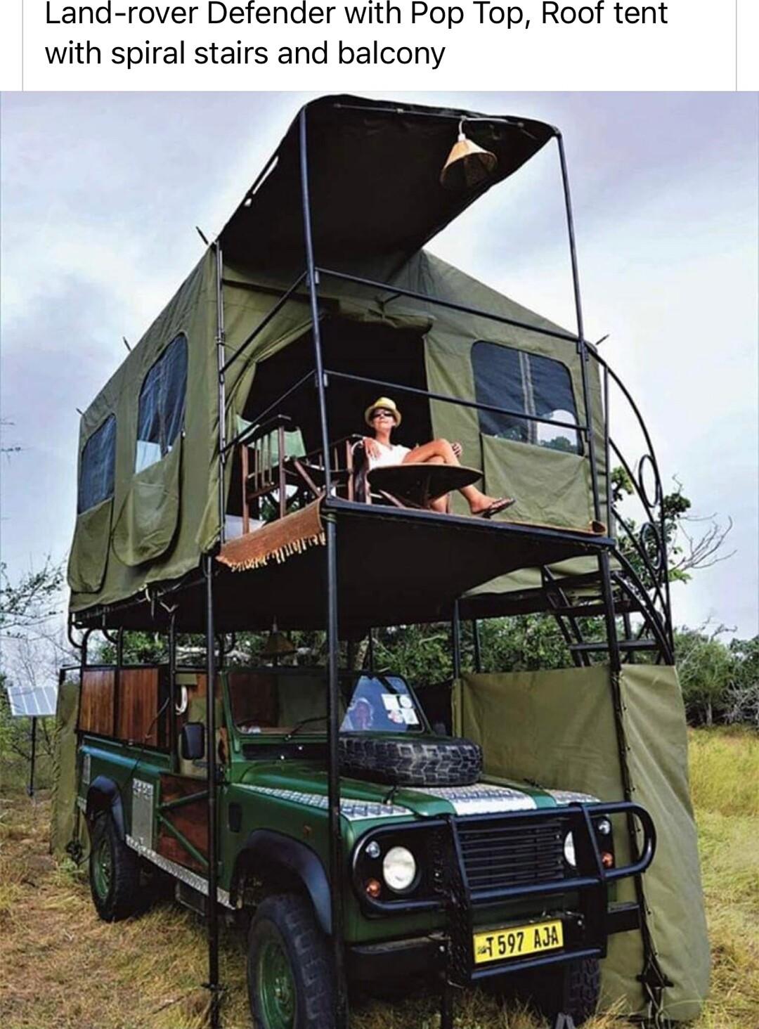 Land rover Defender with Pop Top Root tent with spiral stairs and balcony