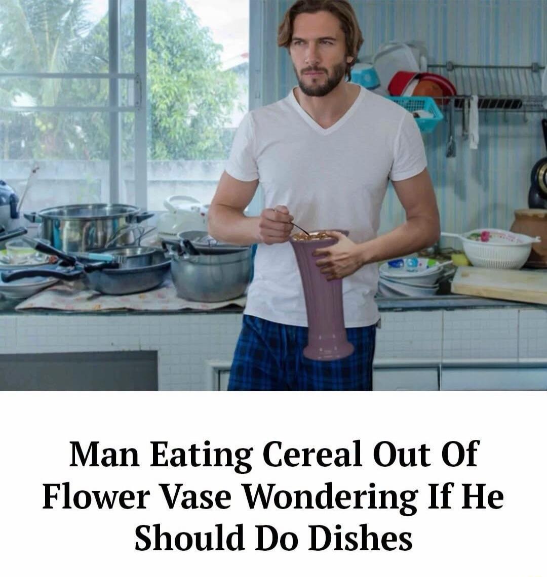 Man Eating Cereal Out Of Flower Vase Wondering If He Should Do Dishes