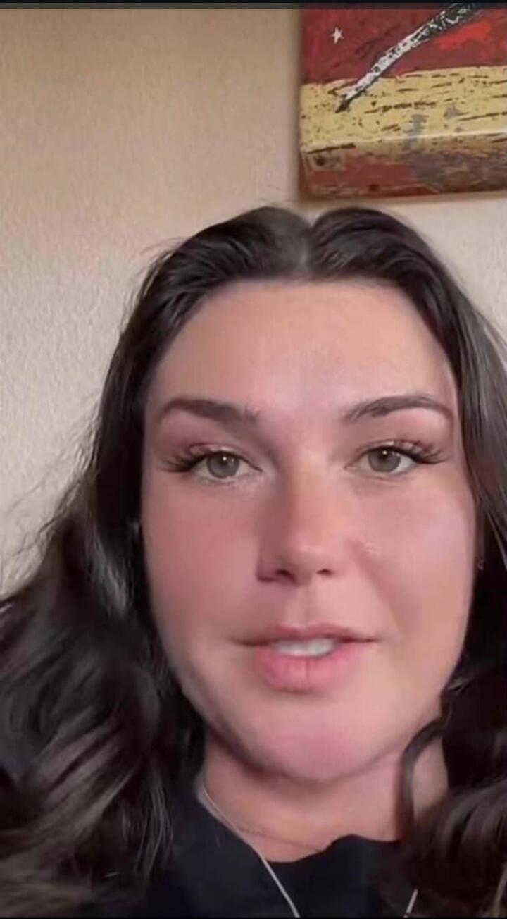 A woman is speaking directly to the camera, likely sharing her thoughts or a story.