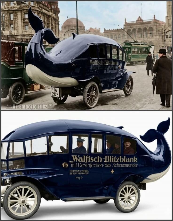 The text on the vintage whale-shaped car reads: 