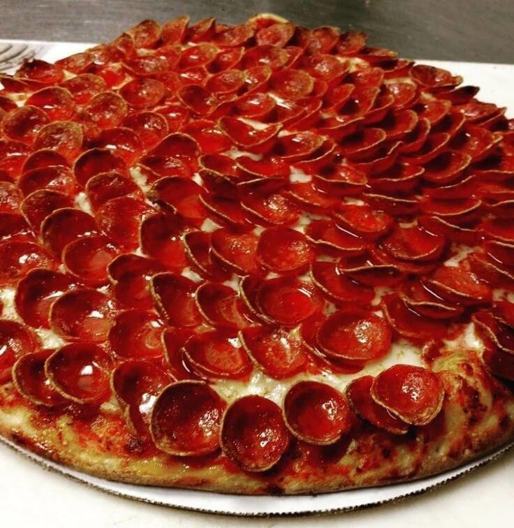 A close-up shot of a pepperoni pizza.